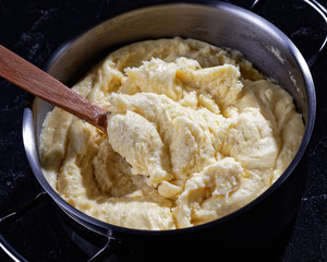 close-up of aligot, cheesy mashed potato dish