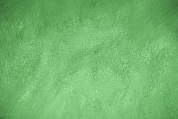 watercolor paint green on a sheet of paper