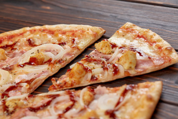 tasty pizza on the wooden background