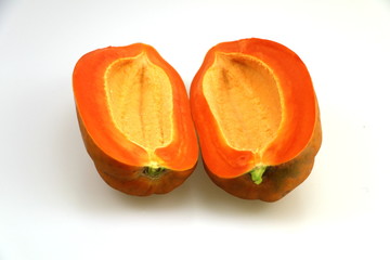 Yellow papaya, cut in half, white background