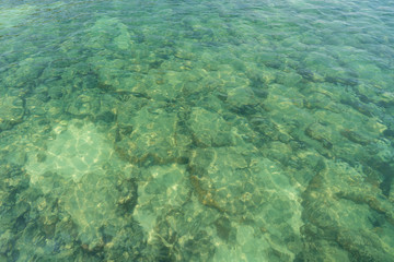 soft wave clear blue transparency sea ocean water and rocks at the bottom of the tropical paradise summer sea view at PP Island, Krabi, Phuket, Thailand.