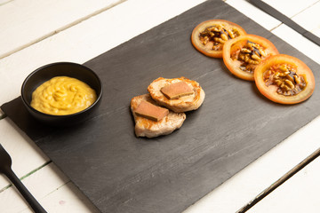 Pork tenderloin dish with pate and tomato and walnut salad