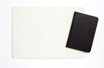Top view of open stitch blank recycled paper cover notebook on white background.