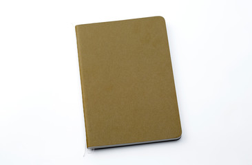 Top view of closed stitch blank recycled paper cover notebook on white background.