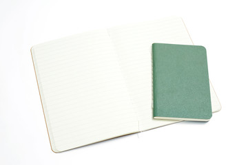 Top view of open stitch blank recycled paper cover notebook on white background.