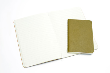 Top view of open stitch blank recycled paper cover notebook on white background.