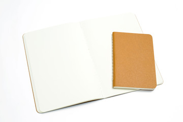 Top view of open stitch blank recycled paper cover notebook on white background .