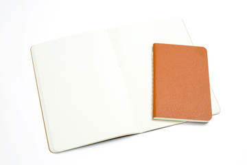 Top view of open stitch blank recycled paper cover notebook on white background .