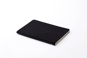 Top view of closed stitch blank recycled paper cover notebook on white background.