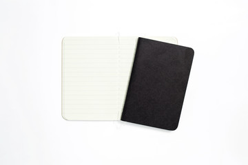 Top view of open stitch blank recycled paper cover notebook on white background.