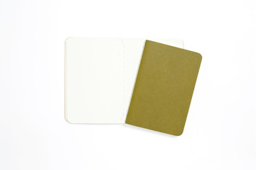 Top view of open stitch blank recycled paper cover notebook on white background.