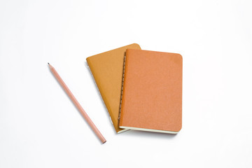 Top view of closed stitch blank recycled paper cover notebook on white background.