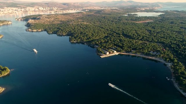 Aerial view of a boat navigating at Sveti ante canal, Šibenik, Croatia