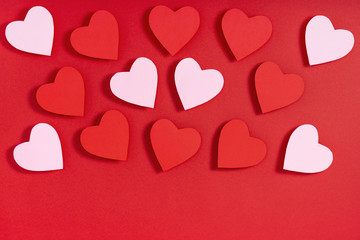 Valentine hearts on red surface. Present, surprise, congratulation. Top view, flat lay, from above, copy space