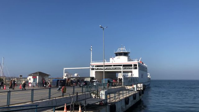Time lapse shot of people and cars get on the ferry at Mudanya, Gemlik Vapur iskelesi