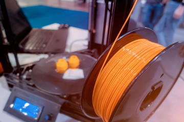 Orange plastic wire for 3D printer - obrazy, fototapety, plakaty