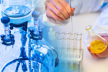 Chemistry. Use of a rotary evaporator in the laboratory. Hands of a man with flasks. Man mixes the reagents. Sale of chemical equipment. Test tube with yellow liquid in the hands of a lab assistant