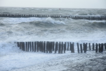 breakwaters on the Dutch coast during a storm with high waves