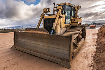 Excavator and heavy machinery in the construction of a highway