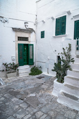 Historic center of white city of Ostuni in Puglia, in a day of August