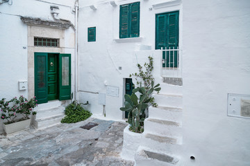 Naklejka premium Historic center of white city of Ostuni in Puglia, in a day of August