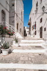 Fototapeta na wymiar Historic center of white city of Ostuni in Puglia, in a day of August