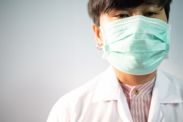 Doctor in white coat on white background.