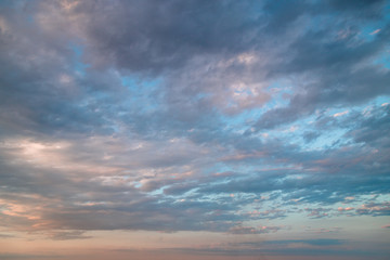 Naklejka na ściany i meble Sunset sky with colored clouds
