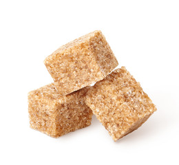 Demerara brown sugar cubes isolated on white background.