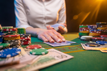Playing poker or blackjack. Casino, playing in a night club.