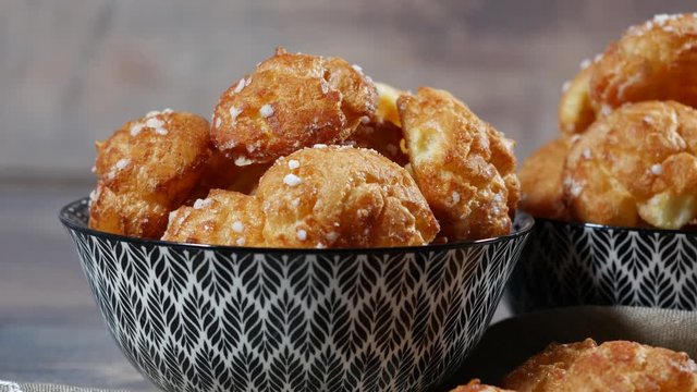 Chouquette, french choux pastry on the wooden table