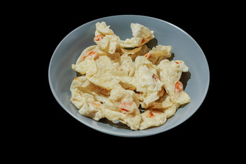 Fried Fish Dumplings put in the gray plate, in black background