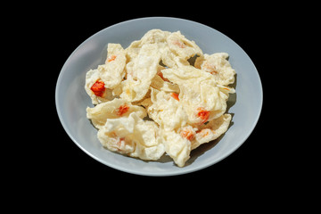 Fried Fish Dumplings put in the gray plate, in black background
