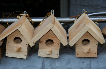 Handmade wooden nesting boxes placed on a counter for sell