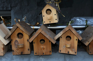 Handmade wooden nesting boxes placed on a counter for sell