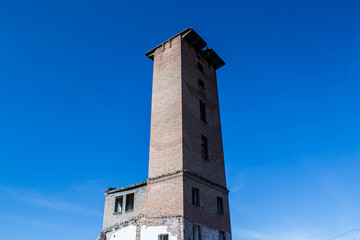 Abandoned old building on a background of blue sky