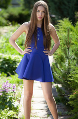 Fototapeta premium Portrait of beautiful young girl in summer garden.