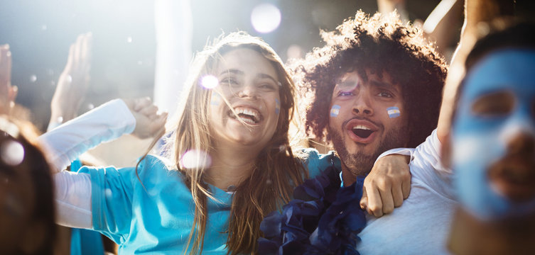 Cheering Couple At Football Match