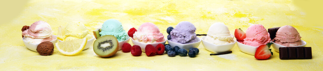 Various of ice cream flavor whit fresh blueberry, strawberry, kiwi, lemon, vanilla setup on rustic background . Summer and Sweet cold ice cream