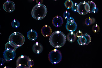 Blurred of Bubble on black background, Bokeh with background.