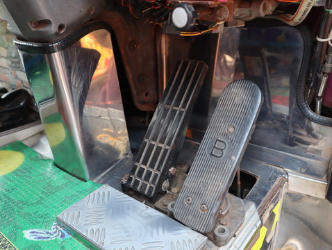 accelerator and brake pedal inside a car