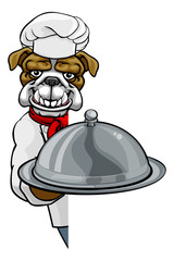 A bulldog chef mascot cartoon character holding a silver platter cloche dome of food peeking round a sign
