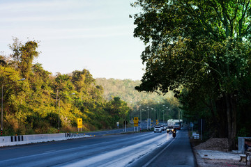 Obraz premium Beautiful green road in countryside, Landscape road with green forest, Main road on the mountain