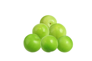 Green plums isolated on white background. Close-up. Top view.