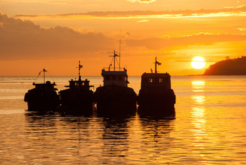 Fisher boats on sunset at the sea - Borneo, Indonesia
