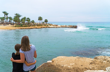 Family enjoying vacation on Latchi Adams Beach in Ayia Napa, Cyprus.