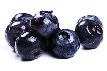 a handful of blueberries close-up isolated on white background