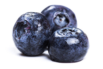 a handful of blueberries close-up isolated on white background