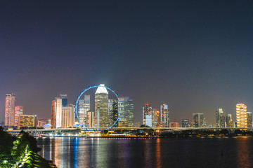 Naklejka premium Singapore Landscape of business building around Marina bay, Singapore Skyline at night view the business bay district on Marina bay at dusk