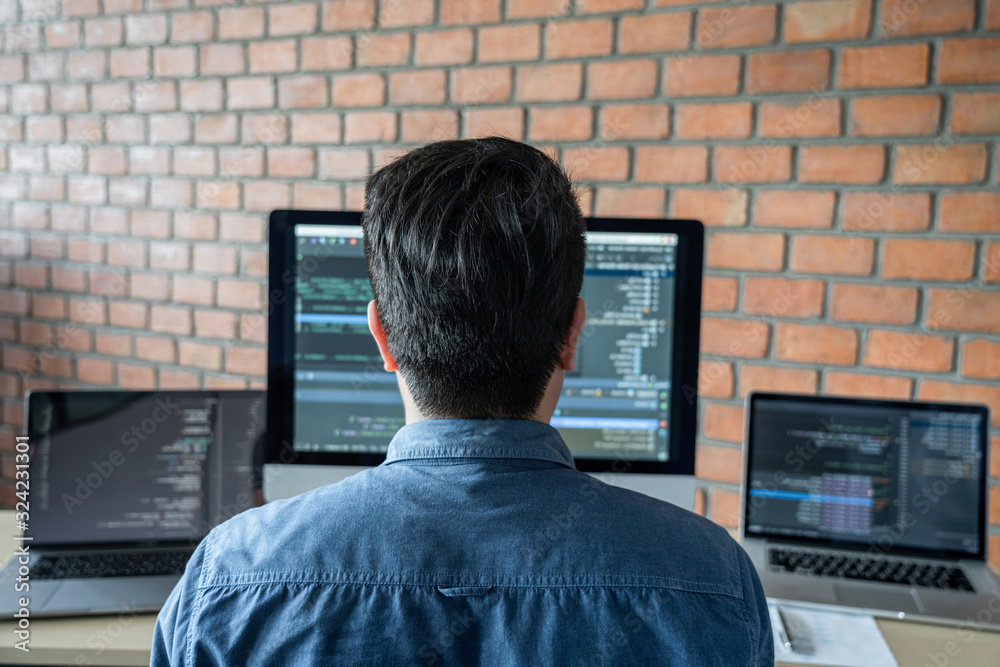 Aufkleber Young Professional programmer working at developing programming and website working in a software develop company office, writing codes and typing data code, Programming with HTML, PHP and javascript